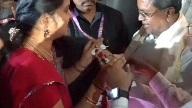 India News | Karnataka CM Siddaramaiah Receives a Garland Made of Free Bus Tickets