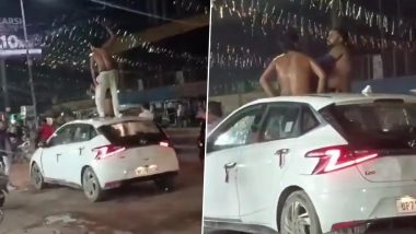 Prayagraj Viral Video: Semi-Naked Duo Drink Alcohol, Shower Each Other With Liquor on Car in Uttar Pradesh; Police Seize Vehicle After Clip Surfaces