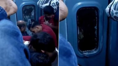 Seat Struggle in Indian Railway: Man Breaks Glass of Train Door After Being Unable to Board Due to Ticketless Travellers, Old Video Goes Viral