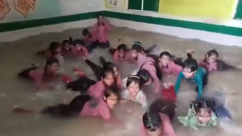 UP: Government School Classroom Turned Into Swimming Pool for Students in Kannauj to Maintain Attendance Amid Soaring Temperatures, Video of Kids Enjoying in Water Surfaces