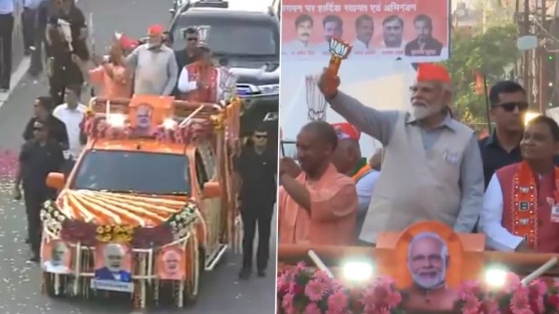 PM Narendra Modi Showered With Flower Petals As He Holds Roadshow in Ghaziabad (Watch Video)