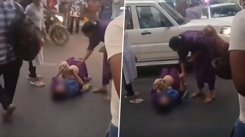 Delhi: Woman Lies Down on Road Outside Police Station, Demands Cops to Arrange Hotel for Her; Viral Video Surfaces