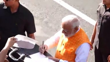 PM Narendra Modi Greets People, Gives His Autograph After Casting Vote at Ahmedabad School in Third Phase of Lok Sabha Elections 2024 (See Pics and Videos)