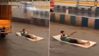 ‘Aladdin on Magic Carpet’: Man Relaxes on Mattress, Floats on Waterlogged Road Amid Heavy Rains in Pune (Watch Video)