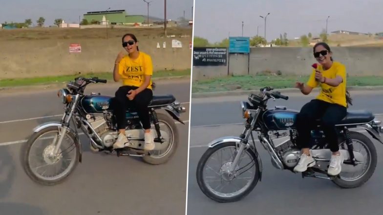 Pune Woman's Dangerous Bike Stunt Viral Video: Young Biker Rides Bike Hands-Free While Performing on Bollywood Song, Sparks Outrage Online (Watch)