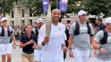 Paris Olympic Games 2024: Former French Footballer Thierry Henry Carries Olympic Flame Through Capital City on Bastille Day