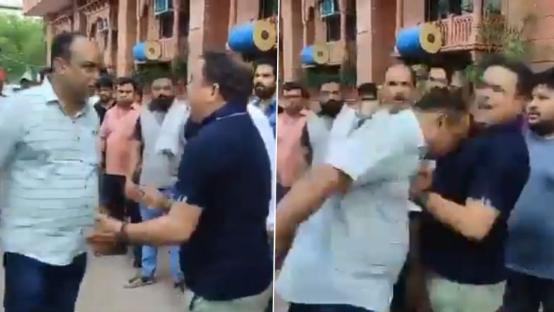 Varanasi ADM Alok Kumar Headbutts Owner Protesting Against Demolition of Hotel (Watch Video)