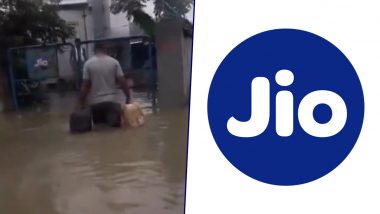 Uttar Pradesh Rains: Reliance Jio Shares Video of Its Network Engineer Pushing Forward in Waist-Deep Water To Fill Generator To Ensure Connectivity During Flood in Gorakhpur