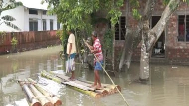India News | Assam Floods: Over 55,000 People Reel Under Deluge in Morigaon; Villagers Seek Shelter on Embankments, Roads