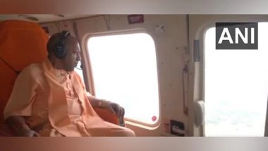 India News | UP: CM Yogi Inspects Flood-affected Areas in Shravasti; Distributes Relief Materials