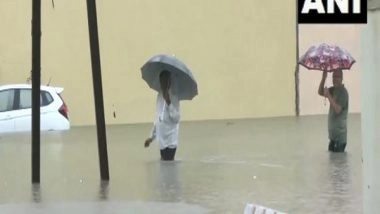 India News | Gujarat: Heavy Rainfall in Porbandar, Junagadh, Devbhumi Dwarka Cause Waterlogging, Traffic Snarls