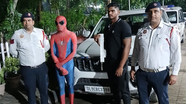 ‘Spiderman’ Fined in Delhi: Man Dressed As Superhero Performs Dangerous Stunt by Sitting on Moving Car’s Bonnet in Dwarka, Police Impose Fine After Video Goes Viral