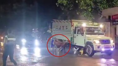 Uttar Pradesh: Drunk Man Narrowly Escapes Truck Collision on Busy Road While Sitting on Chair in Pratapgarh, Police Respond After Video Goes Viral