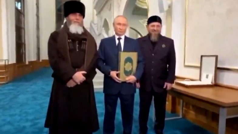 Vladimir Putin Kisses Quran, Poses for Cameras With Islamic Holy Book at Prophet Isa Mosque in Chechnya (Watch Video)