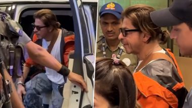 Shah Rukh Khan Makes Stylish Appearance at the Mumbai Airport in Orange Hoodie As He Jets Off to Undisclosed Location (Watch Video)