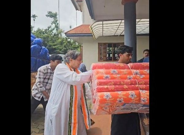 India News | We Have Brought Soft, Spongy Bedrolls for the Homeless: Shashi Tharoor Helps in Unloading Relief Supplies in Wayanad
