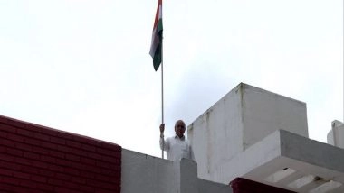 India News | Gujarat CM Bhupendra Patel Hoists National Flag at His Residence as Part of 'Har Ghar Tiranga' Campaign