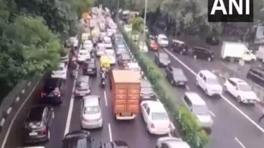 India News | Heavy Rain Causes Chaos in Delhi; Severe Waterlogging, Traffic Congestion Reported