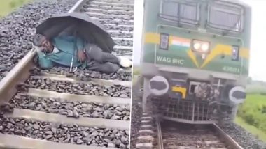 Prayagraj: Man Sleeps on Railway Track With an Umbrella, Loco Pilot Stops Train and Wakes Him Up; Video Surfaces