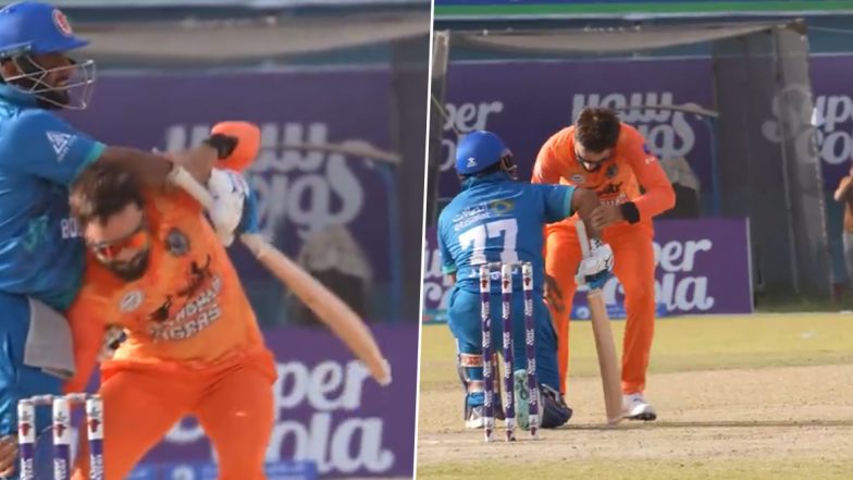 Rashid Khan Hilariously Tries To Lift Mohammad Shahzad After Dismissing Him During Bost Defenders vs Speen Ghar Tigers Match in Shpageeza Cricket League 2024 (Watch Video)