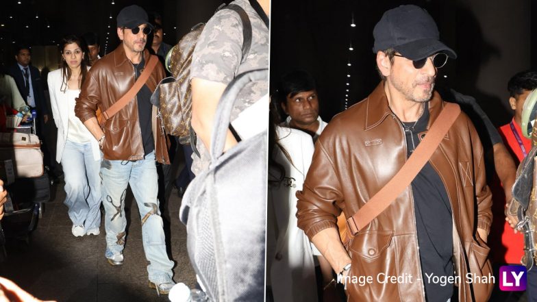 Airport Diaries: Shah Rukh Khan Rocks Brown Leather Jacket, Black Cap, Sunglasses and Cool Denims, Turns Heads at Mumbai Airport (Watch Video & Pics)