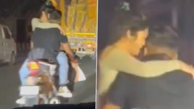 Video of Reckless Couple Romancing on Bike in Vikaspuri Goes Viral, Obscene Act While Dangerously Riding Through Heavy Delhi Traffic Irks Netizens as They Call for Strict Action!