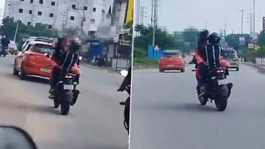 Couple Romance on Bike in Hyderabad: Girl Sits on Man’s Lap, Hugs and Kisses Him As He Rides 2-Wheeler on Busy Road; Viral Video Surfaces