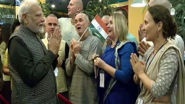 World News | PM Narendra Modi Welcomed with 'Krishna Bhajan' Upon His Arrival at Hotel Korston in Kazan