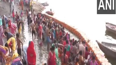 India News | Uttar Pradesh: Devotees Take Holy Dip in River Yamuna on Bhai Dooj