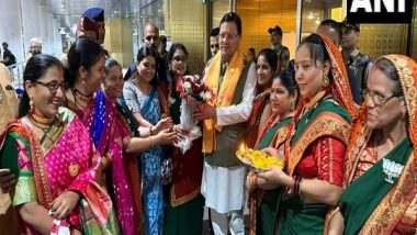 India News | Uttarakhand CM Pushkar Singh Dhami Welcomed by Migrant Uttarakhandis at Mumbai Airport Ahead of Maharashtra Elections