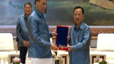 World News | Rajnath Singh Exchanges Gifts with Lao Counterpart at ADMM-Plus Gala