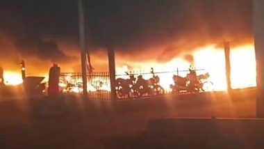 Varanasi Railway Station Fire: 200 Motorcycles Destroyed After Blaze Erupts in Parking Area, Firefighting Operations Underway (Watch Video)