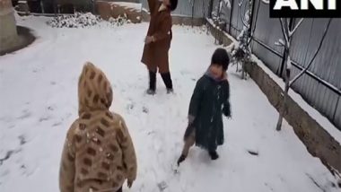 India News | J-K: Pulwama Transforms into Winter Wonderland; Children Embrace Snowfall