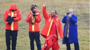 Lewis Hamilton Waves to Fans After Taking His Maiden Lap in Ferrari F1 Car for Upcoming Season