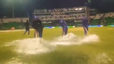 Groundstaff Slips and Falls While Trying to Wipe Water From Wet Patches On Gaddafi Stadium Outfield During AFG vs AUS ICC Champions Trophy 2025 Match (Watch Video)