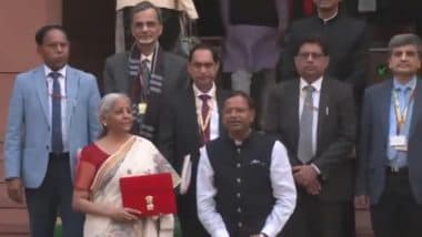 Budget 2025: Nirmala Sitharaman Continues Paperless Budget Tradition, Poses With Digital Tablet Wrapped in ‘Bahi-Khata’ Pouch Outside Parliament (Watch Video)