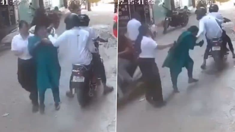 Chain Snatching Caught on Camera in Delhi: 2 Bike-Borne Men Snatch Woman’s Chain in Broad Daylight in Nihal Vihar, CCTV Video Surfaces Chain Snatching Caught on Camera in Delhi: 2 Bike-Borne Men Snatch Woman’s Chain in Broad Daylight in Nihal Vihar, CCTV Video Surfaces