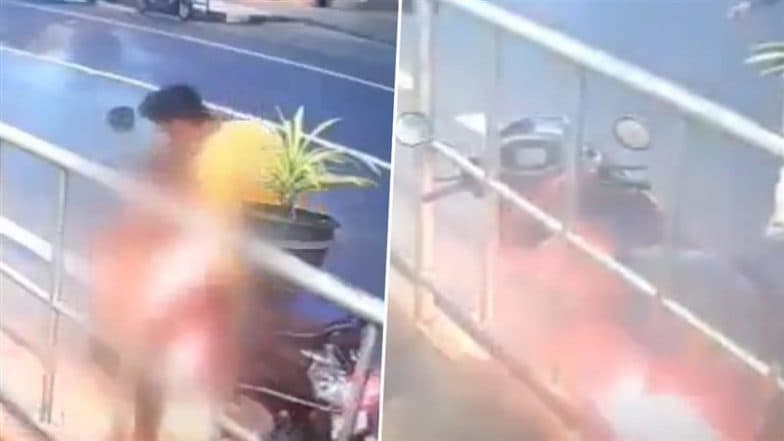 Palakkad Scooter Fire: Father and Son Narrowly Escape As 2-Wheeler Suddenly Bursts Into Flames in Kerala’s Mannarkad; CCTV Video Surfaces
