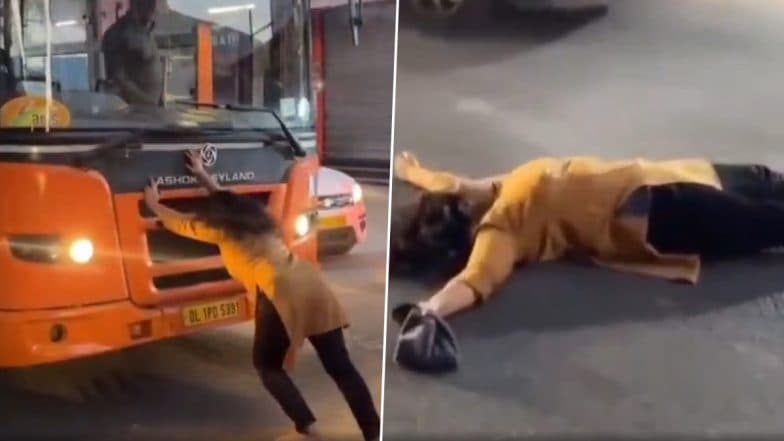 Delhi: Traffic Disrupted After Drunk Woman Tries To Push DTC Bus, Lies on Road in Mohan Garden; Video Goes Viral