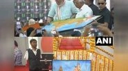 India News | PM Modi Signs Painting by Renowned Mouth, Foot Painter Manoj Bhingare in Surat Rally
