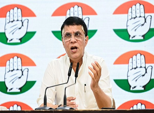 World News | Congress' Pawan Khera Slams Government over 'reducing' Tariff Under Trump's Pressure