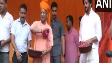 India News | UP CM Yogi and MP Ravi Kishan Attend Holika Dahan Program in Gorakhpur