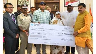 India News | MP CM Yadav Hands over Rs 1 Cr Cheque to ASI Gautam's Family, Killed in Mauganj Violence