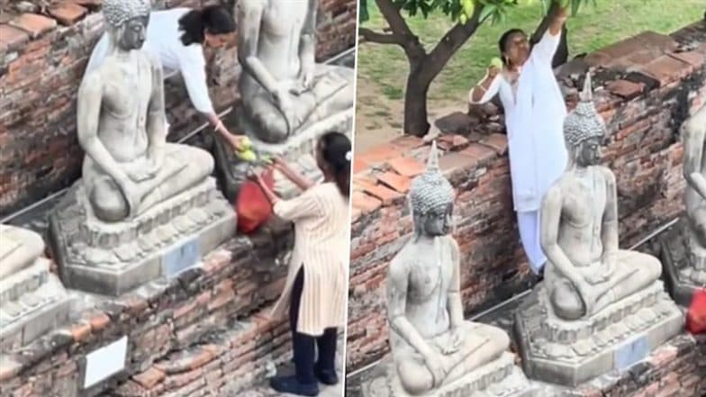 Woman Tourist Climbs Atop Buddha Statue Inside Thai Temple To Pluck Mangoes, Viral Video Sparks Outrage