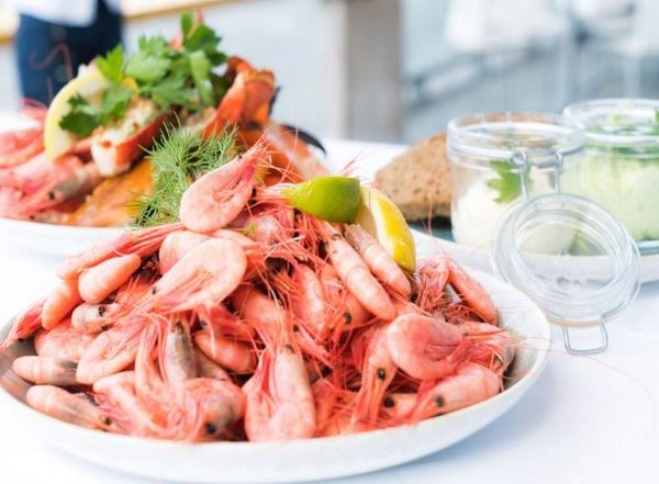 Business News | Indian Seafood Exports to Face Significant Pressure Due to US Reciprocal Tariffs, Says FICCI Study