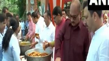India News | Delhi BJP President Virendra Sachdeva Distributes Food on Occasion of Hanuman Jayanti