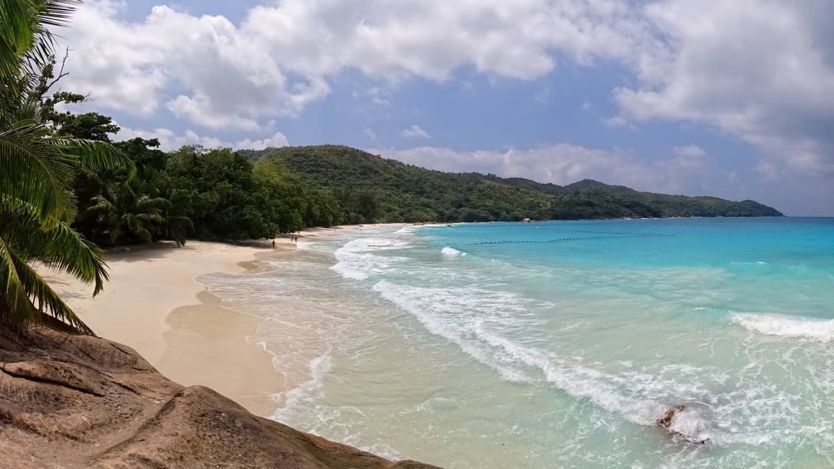 A stunning white-sand beach known for its crystal-clear waters and granite boulders. A stunning white-sand beach known for its crystal-clear waters and granite boulders.