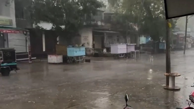 Pali Rains: Heavy Rainfall, Strong Winds Lash Rajasthan District, Disrupting Power Supply in Many Areas; Tree Uprooted, Flooding Reported (Watch Video)