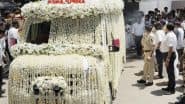 Entertainment News | Nirmal Kapoor's Mortal Remains Taken for Final Rites in Ambulance Decorated with Garlands