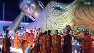India News | Bihar: Monks Light Candles Near India's Largest Reclining Statue of Lord Buddha